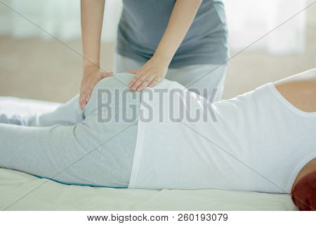 Asian Girl Having Massage By Her Friend At Home