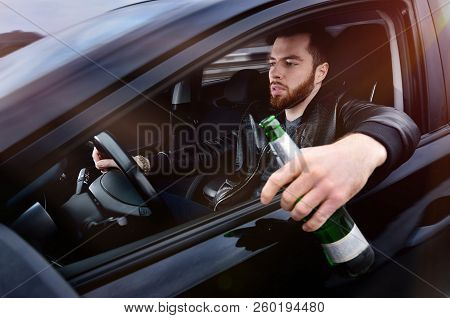 Drinks Alcohol In The Car. The Guy With Beer At The Wheel. Man With Beer. Emergency Situation. Socia