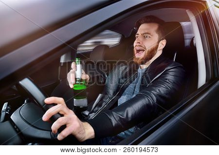 Drinks Alcohol In The Car. The Guy With Beer At The Wheel. Man With Beer. Emergency Situation. Socia