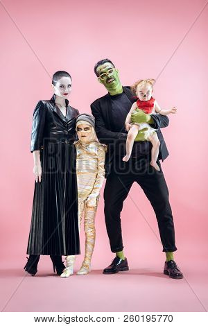 Halloween Family. Happy Father, Mother And Children Girls In Halloween Costume And Makeup. Bloody Th