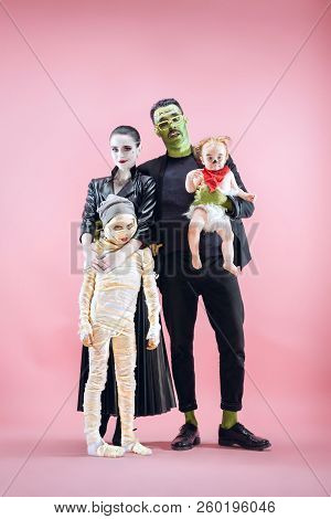 Halloween Family. Happy Father, Mother And Children Girls In Halloween Costume And Makeup. Bloody Th