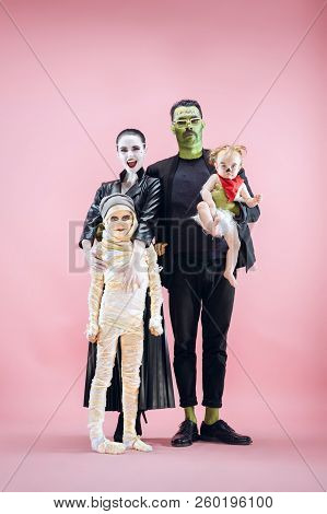 Halloween Family. Happy Father, Mother And Children Girls In Halloween Costume And Makeup. Bloody Th