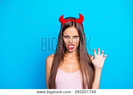 Portrait Of Crazy Mad Wild Straight-haired Caucasian Girl Wearing Red Horns, Showing White Teeth, Pa