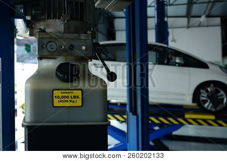 The Black Letters On Yellow Background About Qualification Detail On Hydraulic Oil Box At The Metal
