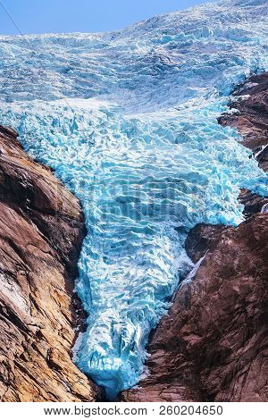 Briksdal Or Briksdalsbreen Glacier With Melting Blue Ice, Norway Nature Landmark Close-up View