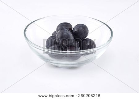 Fresh Black Grapes On White