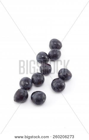 Fresh Black Grapes On White