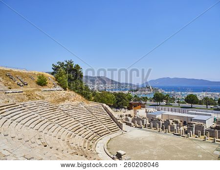 Remains Of The Amphitheatre Of Halicarnassus With Kumbahce Bay And The Castle Of Saint Peter In The 