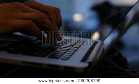 Hands On The Keyboard Close-up Typing On The Keyboard At The Airport Window On The Background Of The