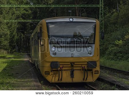 Rozmberk Nad Vltavou Station With Yellow Diesel Train In Summer Day