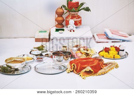 The Ganesha Statue (hindu God Of Wisdom) With Red Velvet Of Kalash On The Back And Worship Items For