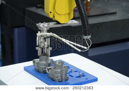 The Robotic Arm Catch The Aluminum Part For Manufacturing   Process .the Hi-technology For Modern Ma