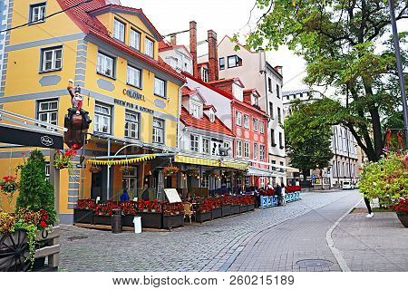 Riga, Latvia - August 29, 2018: Restaurants And Colorful Buildings On Meistaru Street In Old Town