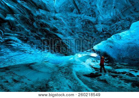 Explorer Inside An Ice Cave, Vatnajokull National Park, Iceland