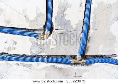 Water Pipes Made Of Polypropylene Pex In The Wall, Plumbing In The House. Installation Of Sewer Pipe