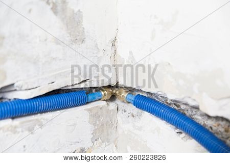 Water Pipes Made Of Polypropylene Pex In The Wall, Plumbing In The House. Installation Of Sewer Pipe