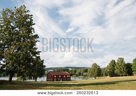Red House Near Lake Under Cloudy Sky, Hamar, Hedmark, Norway