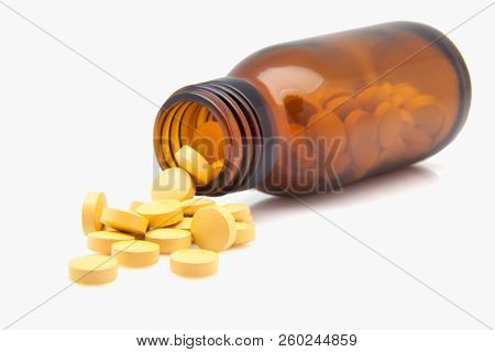 Crystal Receptacle With Pills Spilling On White Background