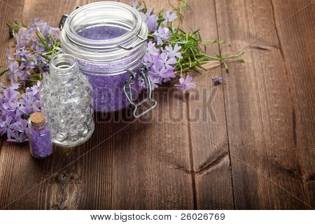 Spa Minerals And Flowers On Wood Background