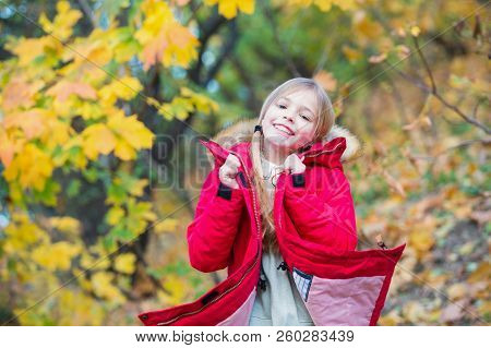 Feel So Cozy In Warm Jacket. Girl Happy In Coat Enjoy Fall Nature Park. Child Wear Fashionable Coat 