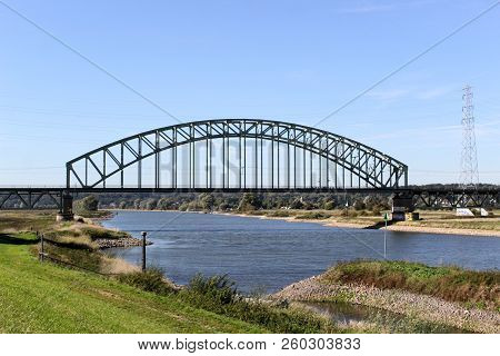 Railway Bridge Which Spans The River Rhine Near Oosterbeek And Arnhem. Under The Bridge Is The Old C