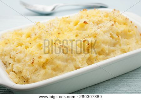 Lightly Mashed Potato Mixed With Sour Cream, Topped With Butter And Breadcrumbs And Baked In The Ove