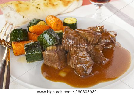 Classic Of Belgian Cuisine, Carbonade De Boeuf A La Flamande Is Beef Simply Cooked In Beer. Here Ser