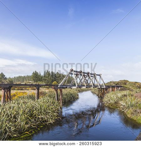 Old Railway Bridge Over Mahinapua Creek, Near Hokitka In The Wst Coast Region Of New Zealand.
