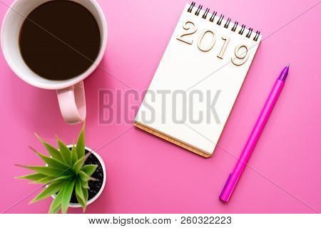 A Notebook C An Inscription 2019 For Records Plans, Goals, Objectives On Purple Table