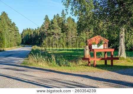 Lovanger, Sweden - August 9, 2018: Traditional Milk Churn Stand Maintained For Decorative Purposes A
