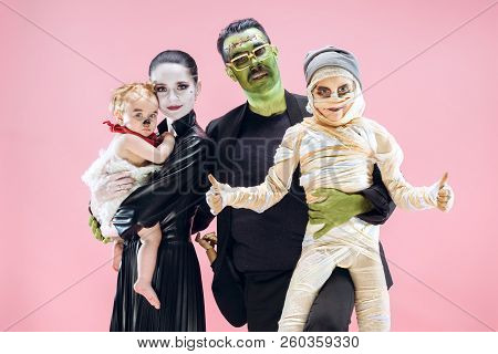 Halloween Family. Happy Father, Mother And Children Girls In Halloween Costume And Makeup. Bloody Th
