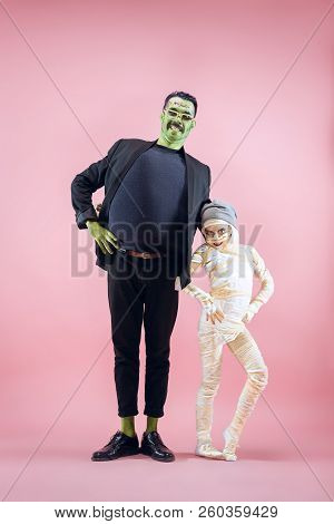 Halloween Family. Happy Father And Children Girl In Halloween Costume And Makeup. Bloody Theme: The 