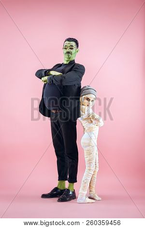 Halloween Family. Happy Father And Children Girl In Halloween Costume And Makeup. Bloody Theme: The 