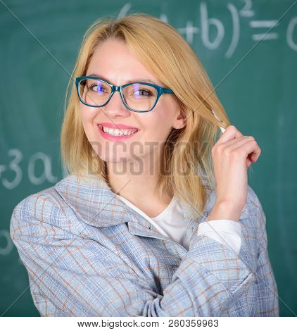 Principles Can Make Teaching More Effective And More Efficient. Woman Teaching Near Chalkboard. Effe