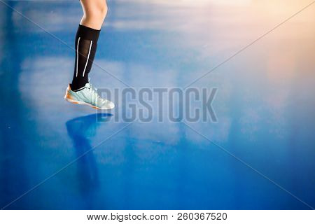 Leg Of Player And Indoor Soccer Sports Hall. Football Futsal Player