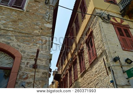 Beautiful Brick Buildings Light Brown With Nice Red Windows In Nauplion. Architecture, Travel, Landscapes, Cruises. July 8, 2018. Nauplion Argolida Greece.