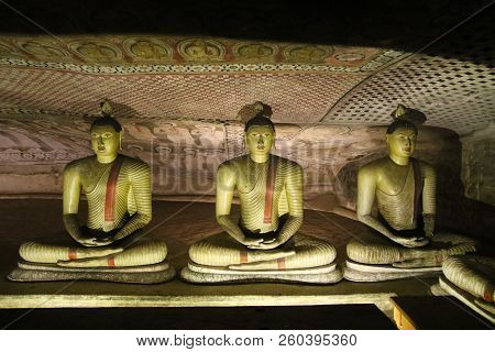 Three Statues Of Buddha In Dambulla Cave Temple In  Sri Lanka