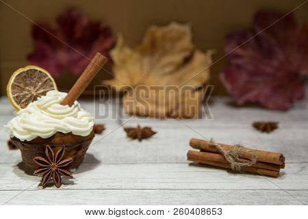 Pumpkin Spice Muffin Frosted With Mascarpone Chesee And Cream, Whipped 
Icing, Decorated With Cinnam