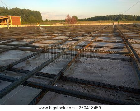 Construction Workers Fabricating Steel Reinforcement Bar At The Construction Site