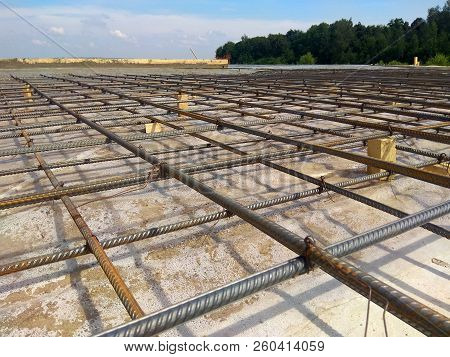 Abstract Background Of Iron Armature Ready For Concreting Metal Armature In Reinforced Concrete Stru