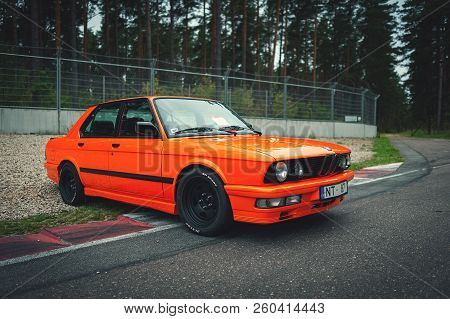 Riga, Latvia - September 2018: Orange Bmw E28 Car Is Staying On A Racing Track