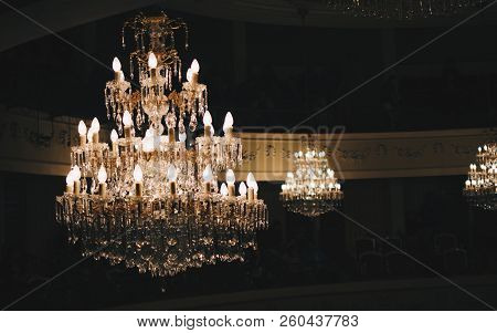 Chandelier From A Theather With Lights On