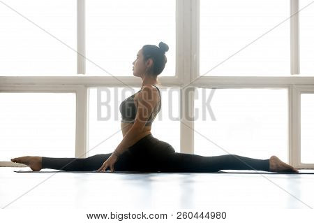 Young Sporty Attractive Woman Practicing Yoga, Doing Monkey God