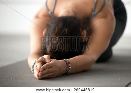 Young Attractive Woman Practicing Yoga, Doing Meditation Exercis