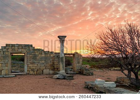 Ruins Of Ancient Chersonesos In The Crimea, Russia. Landscape In The Rays Of The Setting Sun