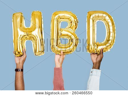 Yellow gold alphabet balloons forming the word HBD