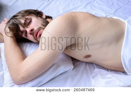 Guy Nude Macho Lay White Bedclothes. Pleasant Relax Concept. Man Unshaven Handsome Guy Naked Torso R