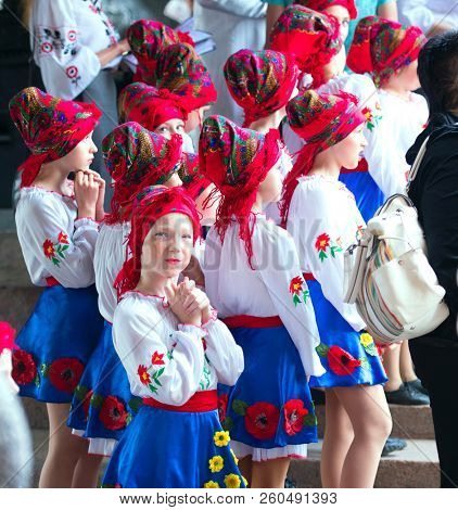 Kharkiv, Ukraine - 17 May 2018 : Group of schoolage dancing girls in bright national clothes and attributes waiting for perfomance at the embroidered shirt holiday in Kharkiv