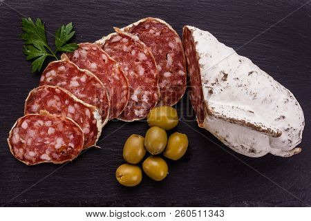 Saucisson Sec Delicious French Salami On A Wooden Background