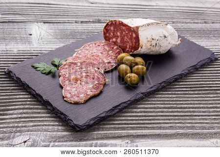 Saucisson Sec Delicious French Salami On A Wooden Background